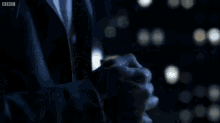 a bbc logo can be seen in the corner of a dark scene