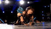 a wrestling match is being broadcasted on stardom