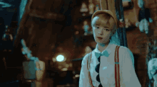 a girl in a pinocchio costume is looking at the camera