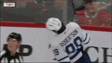 a hockey player with the number 19 on his jersey