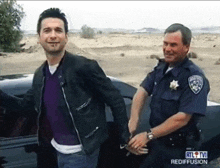 a man is handcuffed by a police officer with rtl tv rediffusion written on the bottom of the photo