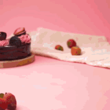 a slice of cake with strawberries and oreos on it