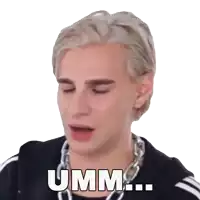 a man with a chain around his neck says umm ...