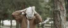 Masked Concealed GIF - Masked Concealed Hiding Face GIFs
