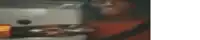 a blurry picture of a person looking at a computer monitor .