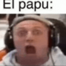 a man wearing headphones is making a funny face .