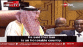 a tv screen shows a man talking about iran