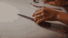 Spin The Knife Death On The Nile GIF - Spin The Knife Death On The Nile Knives GIFs