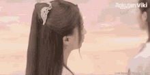a woman 's hair is shown with a rakuten viki logo in the corner