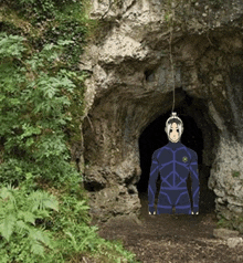 a drawing of a person in a blue suit standing in front of a cave
