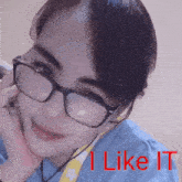 a woman wearing glasses and headphones with the words i like it written below her
