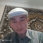 a man wearing a hat and a striped shirt is standing in front of a rug with pika.art written on it