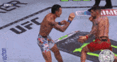 two men are fighting in front of a ufc logo