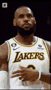 lebron james is wearing a lakers jersey with a beard