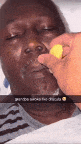 a man laying in a hospital bed with a snapchat caption that says grandpa awoke like dracula
