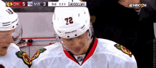 a hockey player wearing a number 72 jersey