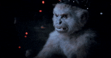 a person is typing on a keyboard with a red light behind the shift key