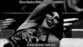 a black and white photo of a wrestler with the caption rhea ripley wwe theme slowed slowlicious threads