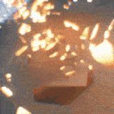 a blurred image of a box with a lot of sparkles coming out of it