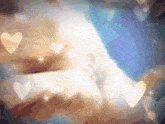 a blurred image of a person 's face with hearts around it
