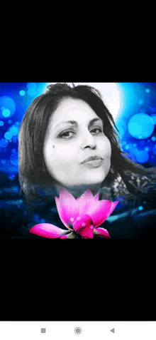 a black and white photo of a woman with a pink flower