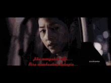a blurred image of a person with the words " maka lakahnallah itu " written in red