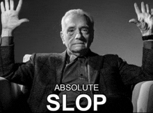 a man sitting in a chair with his hands in the air and the words absolute slop above him