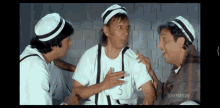 three men are talking in a scene from a shemaroo film