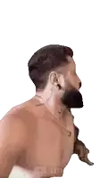 a shirtless man with a beard wearing a necklace