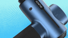 a blue renpho massage gun is sitting on a blue surface