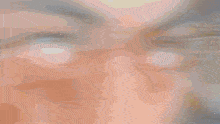 a close up of a person 's eyes with a blurred image