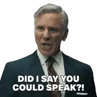 a man in a suit and tie is asking if he could speak