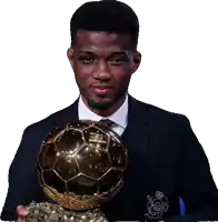 a man in a suit is holding a soccer ball that says ' uefa ' on it