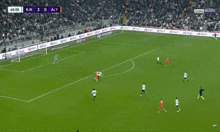 a soccer game between bjk and aly is being played on a sunny day