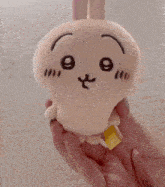 a person is holding a stuffed animal with a tear coming out of its eye