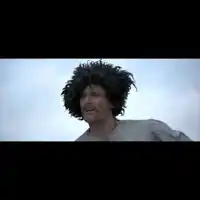 a man wearing a wig and a mustache looks at something