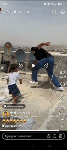 a phone screen shows a video of a man and child