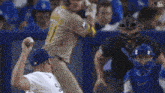 a baseball player with the number 11 on his jersey is about to throw the ball