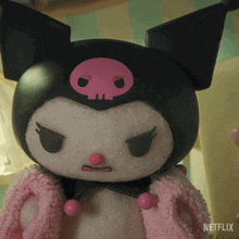 a close up of a stuffed animal with a netflix logo