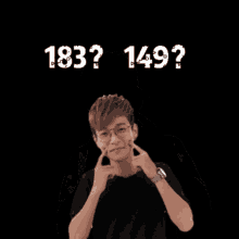 a young man wearing glasses and a black shirt with the number 21 on his head