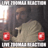 a man with a beard is sitting in front of a sign that says live zoomaa reaction