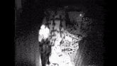 a black and white photo of a woman in a leopard print dress .