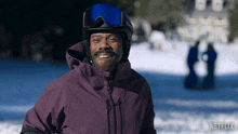 a man wearing a ski helmet and goggles is smiling in the snow with a netflix logo in the background