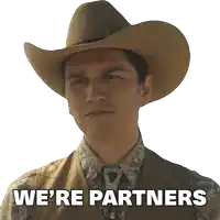 a man in a cowboy hat has the words we 're partners above his head
