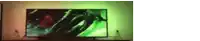 a tv with a green screen is turned on in a dark room