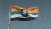 a colorful flag with a blue star in the middle is flying in the wind