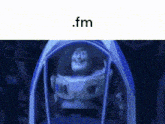 buzz lightyear from toy story is sitting inside of a blue tent in the dark .