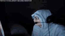 a man wearing headphones is sitting in front of a dxr chair