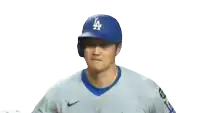 a baseball player for the los angeles dodgers wears a blue helmet