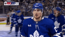 a hockey player wearing a jersey that says ' hulk ' on it